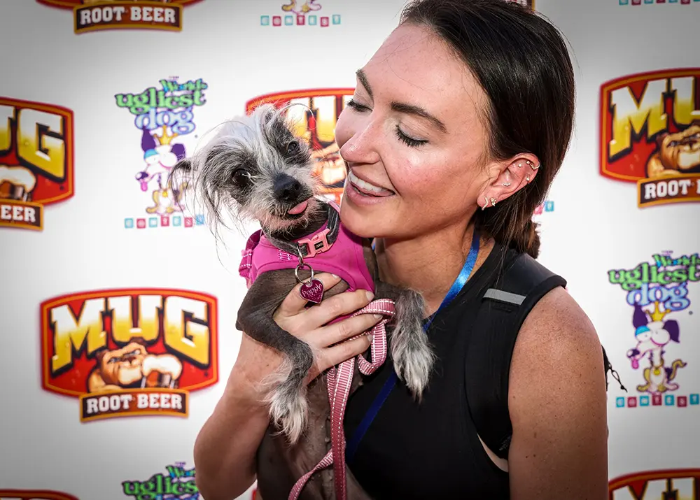 World's Ugliest Dog® 2025 third place winner Poppy and her owner